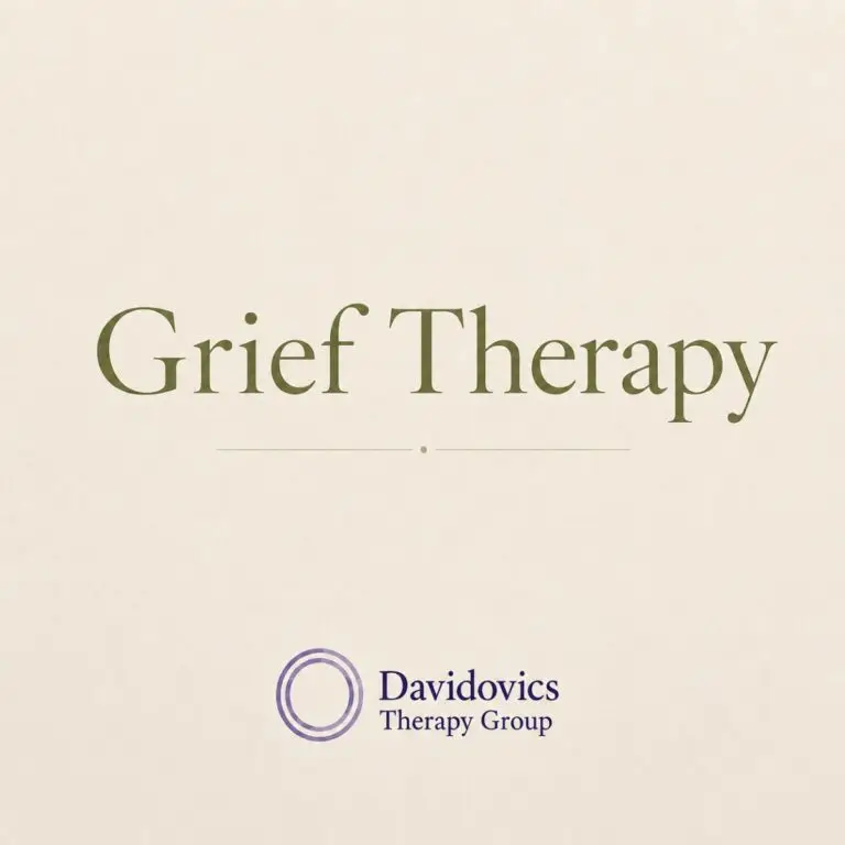 The image shows large green text reading "Grief Therapy" on a beige background with the Davidovics Therapy Group logo and name at the bottom.